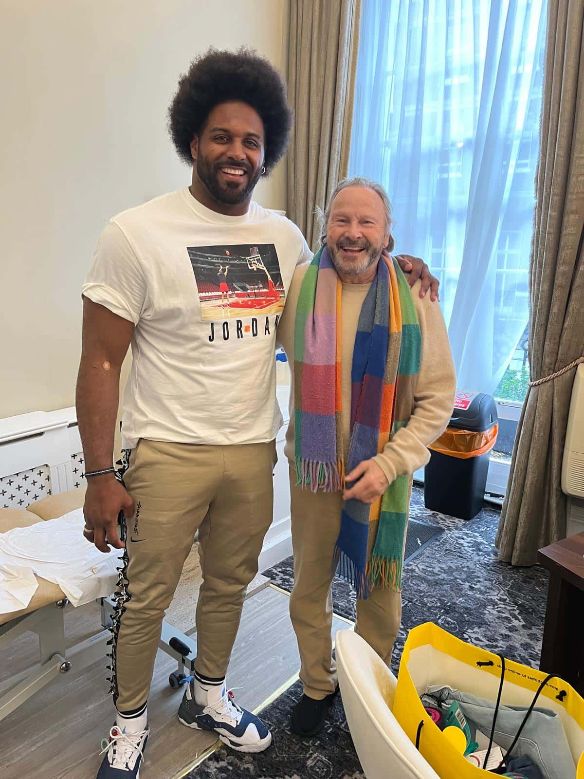 Is Cam Jordan standing on a table